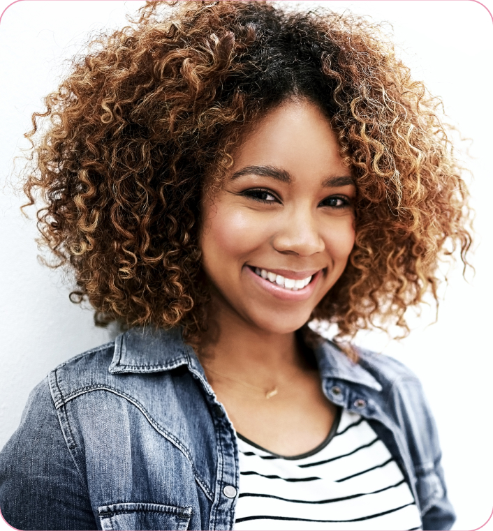 Woman with Curly Hair Blonde Highlights Against a White Background